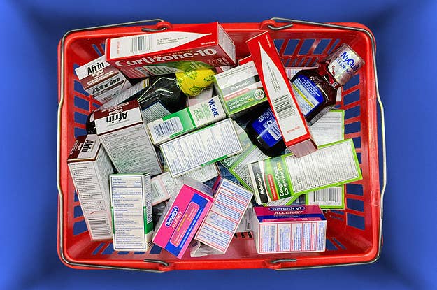 A shopping basket filled to the top with over-the-counter drugs